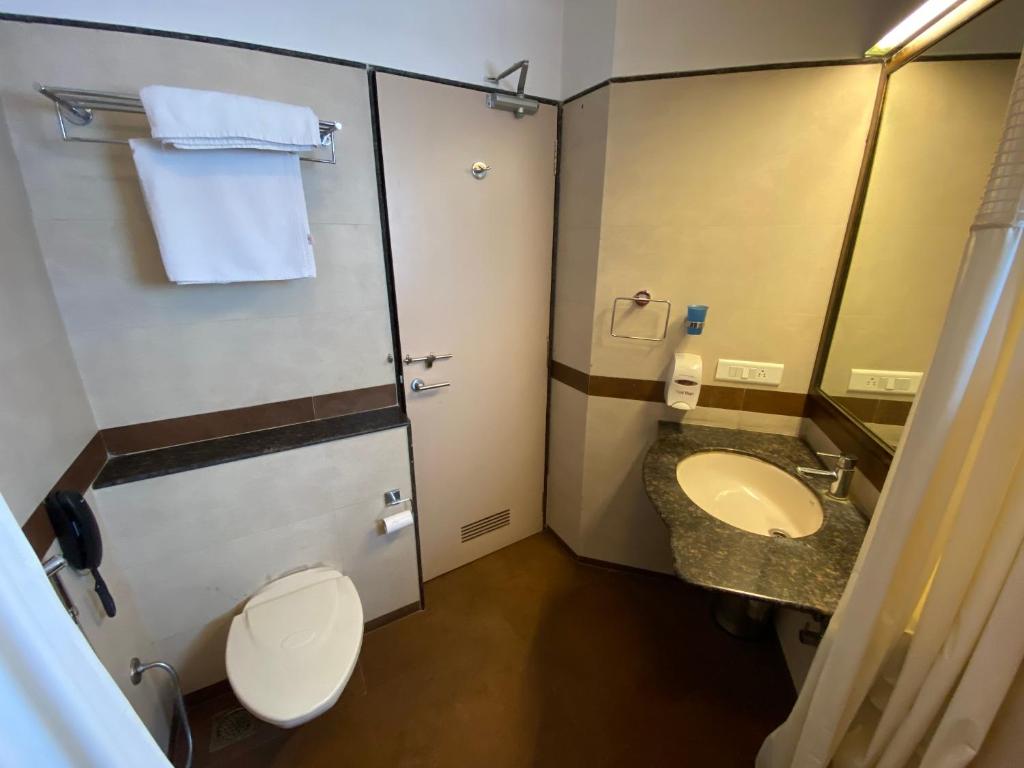 Koupelna v ubytování Panchavati Elite Inn