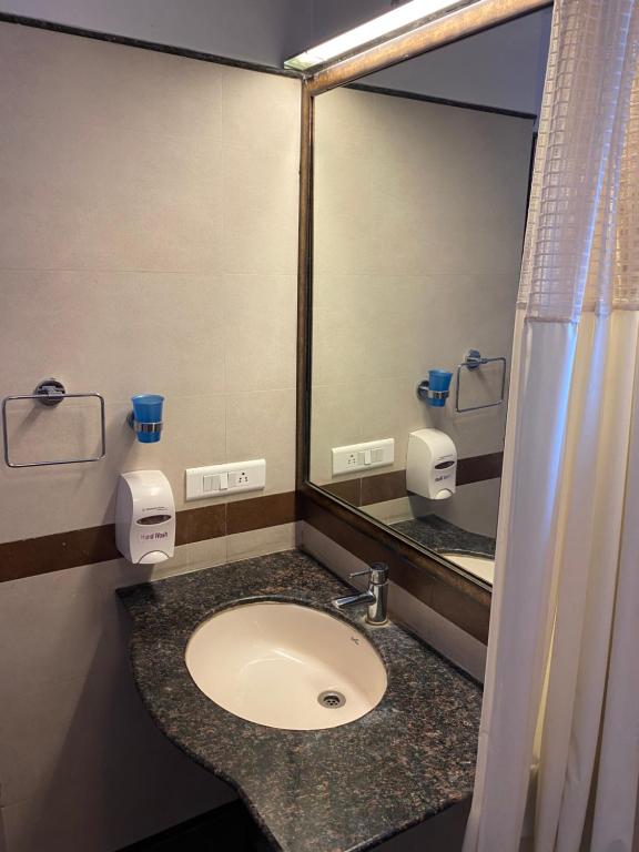 Koupelna v ubytování Panchavati Elite Inn
