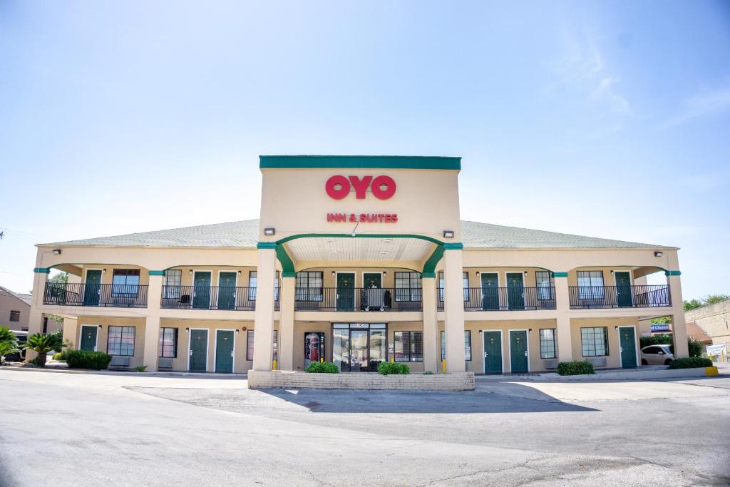 a building with a wmo sign on the front at OYO Inn & Suites Medical Center San Antonio in San Antonio