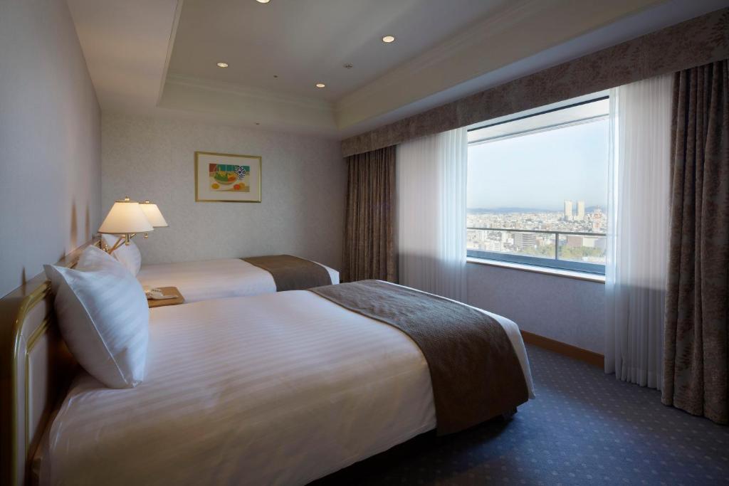 Postel nebo postele na pokoji v ubytování Hotel Agora Regency Osaka Sakai