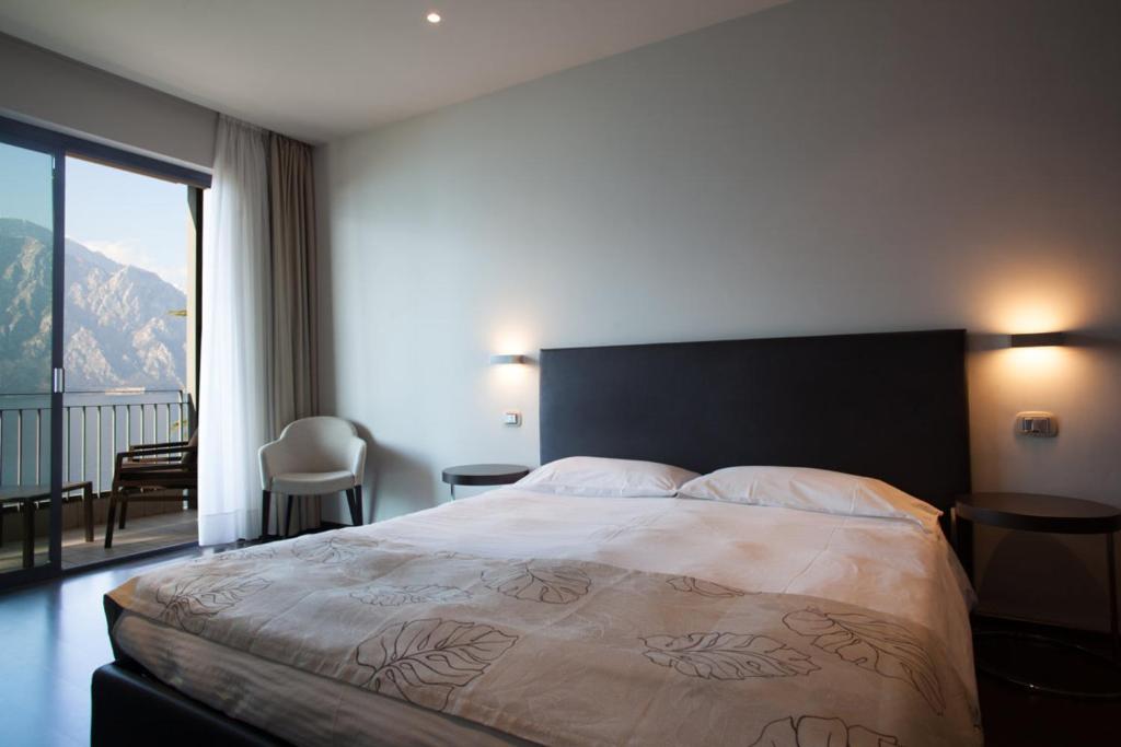 Postel nebo postele na pokoji v ubytování Piccolo Hotel