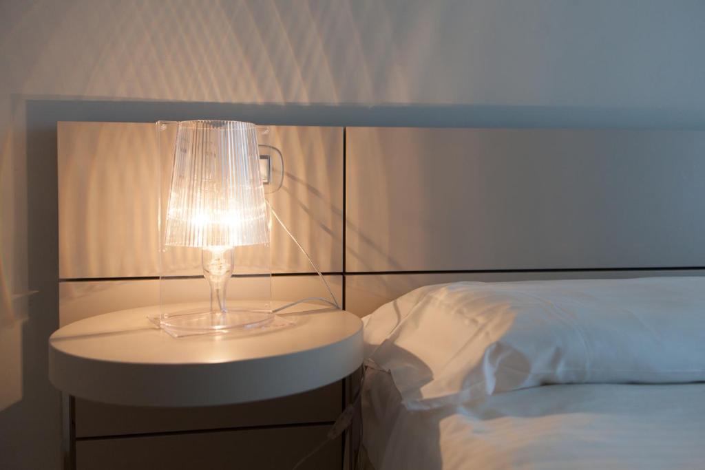 Postel nebo postele na pokoji v ubytování Piccolo Hotel