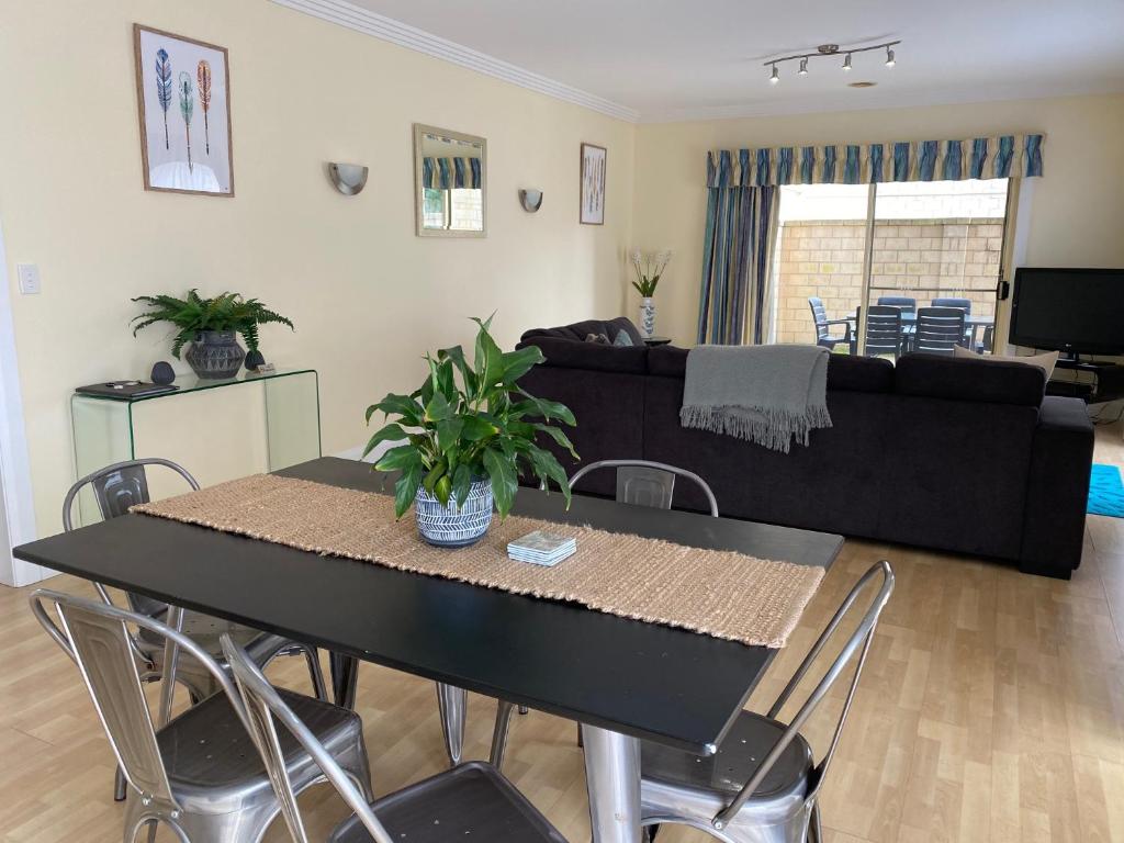 a living room with a table and a couch at Apartment 244 on Bertha, Mount Gambier in Mount Gambier
