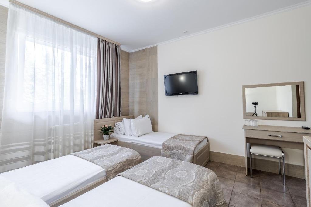 Postel nebo postele na pokoji v ubytování Hotel Adrenalin