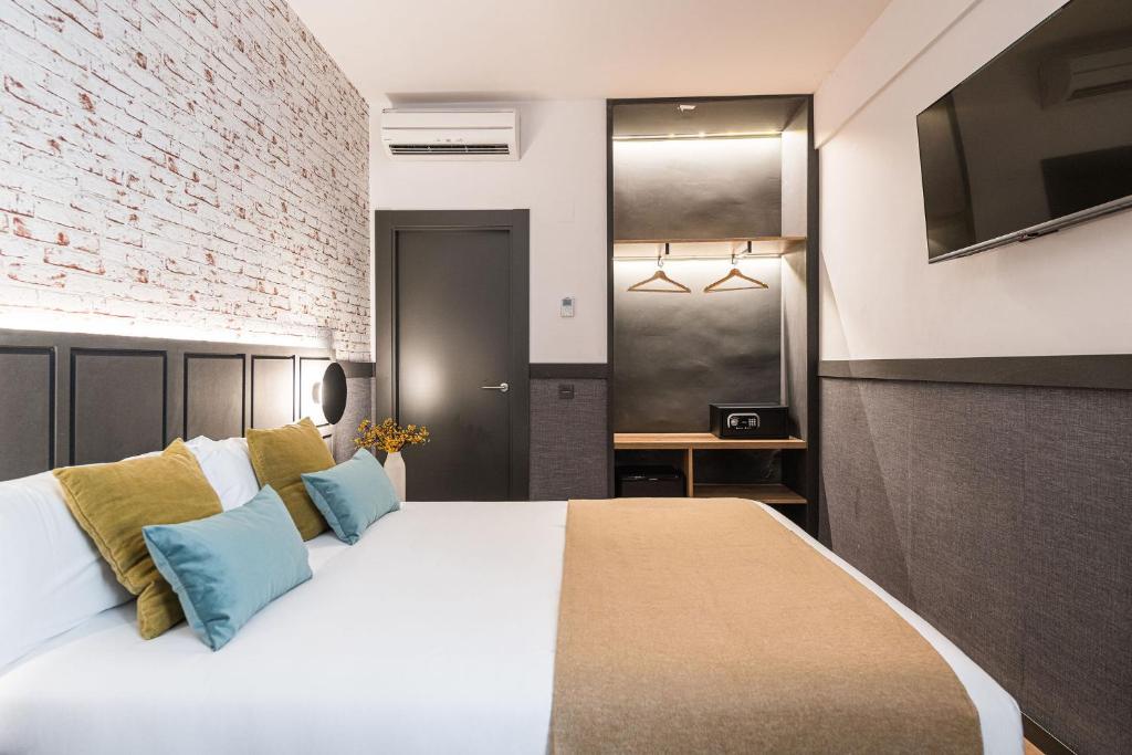 Postel nebo postele na pokoji v ubytování BYPILLOW San Mamés