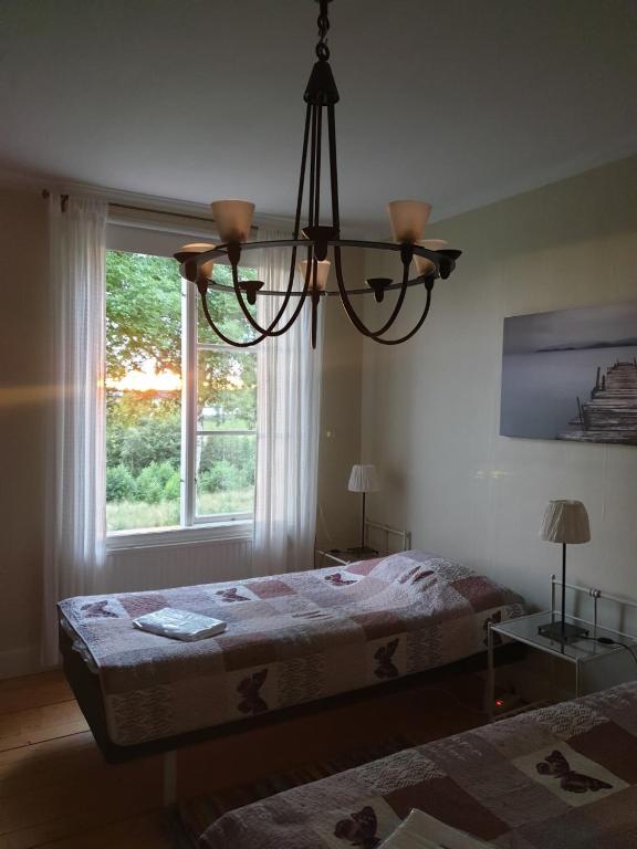 Postel nebo postele na pokoji v ubytování Nya Strandgårdens Wärdshus