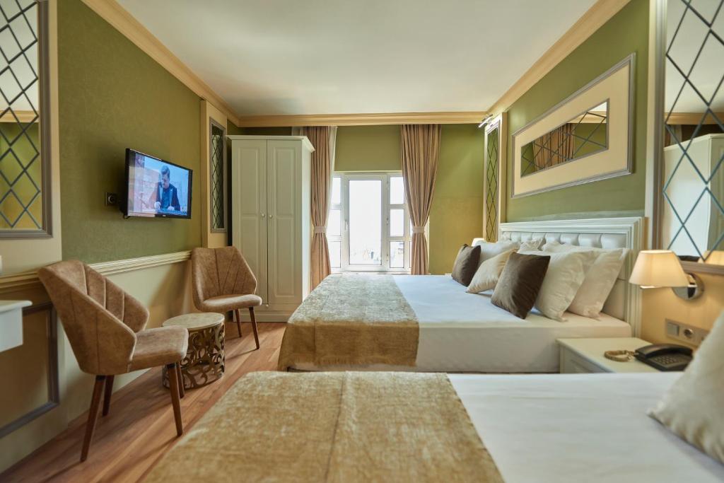Postel nebo postele na pokoji v ubytování Sunlight Hotel