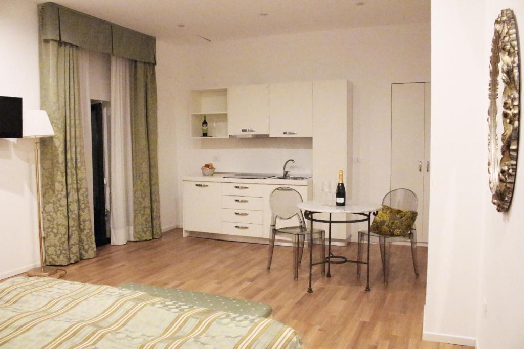 A kitchen or kitchenette at Nerello Suites and Rooms