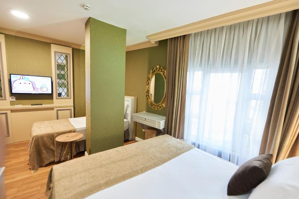 Postel nebo postele na pokoji v ubytování Sunlight Hotel