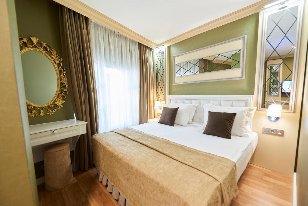 Postel nebo postele na pokoji v ubytování Sunlight Hotel