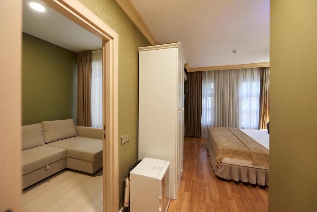 Postel nebo postele na pokoji v ubytování Sunlight Hotel
