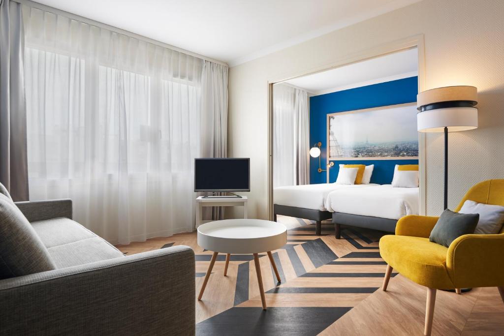 TV a/nebo společenská místnost v ubytování Aparthotel Adagio Porte de Versailles