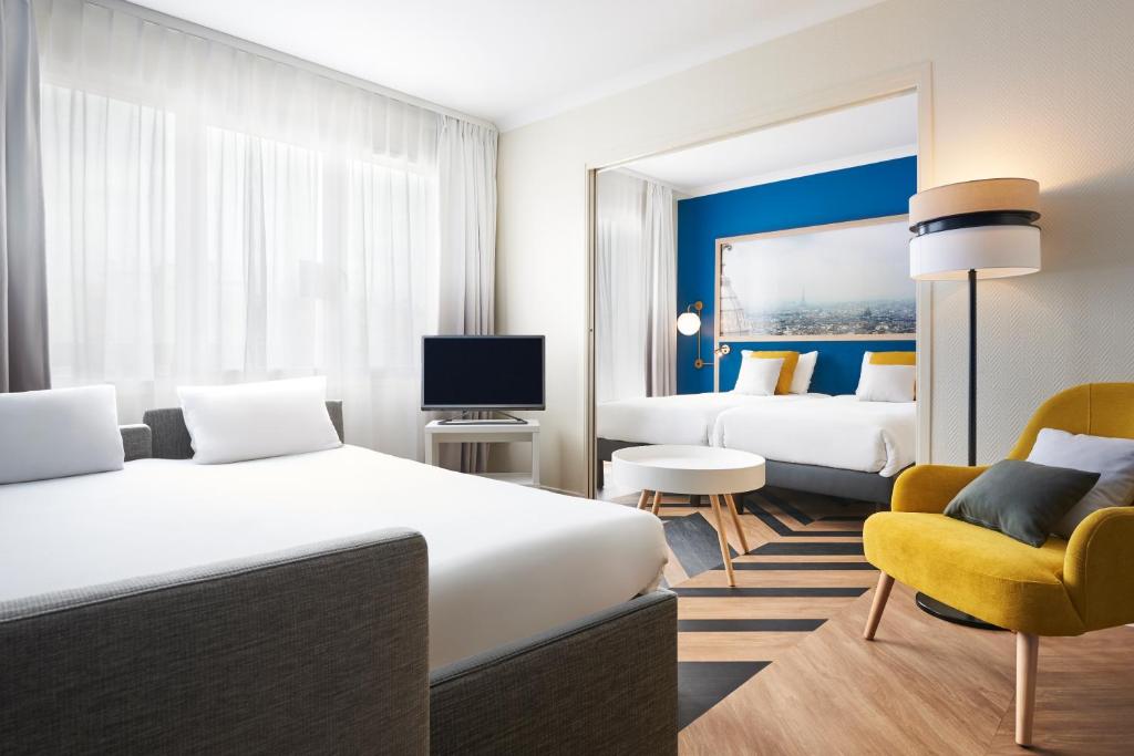 TV a/nebo společenská místnost v ubytování Aparthotel Adagio Porte de Versailles