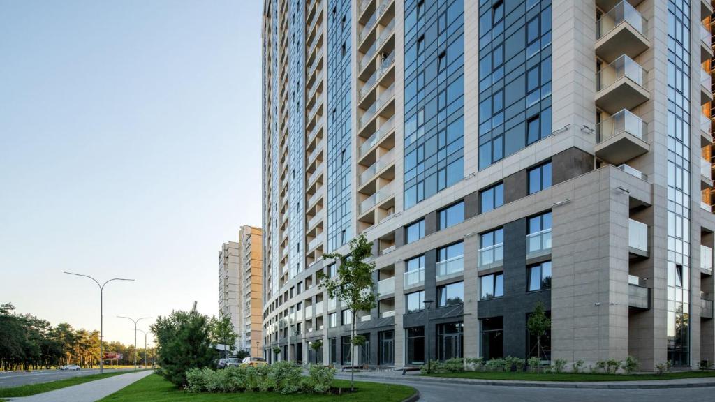 a tall building on a street in a city at Rent Vip apartment in Kyiv in Kyiv