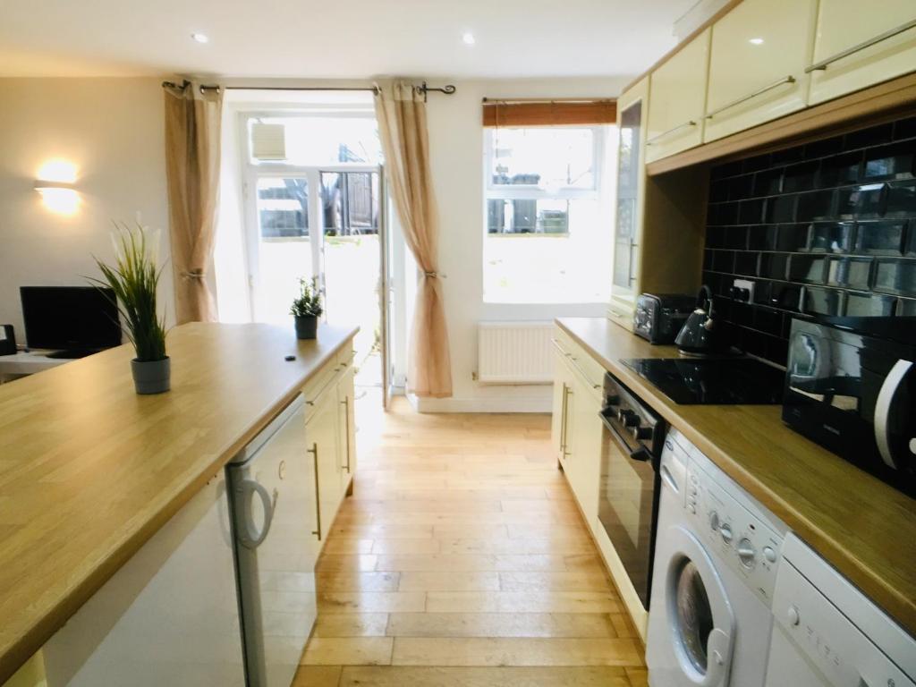 a kitchen with a washer and dryer at Westbourne Villas in Bristol
