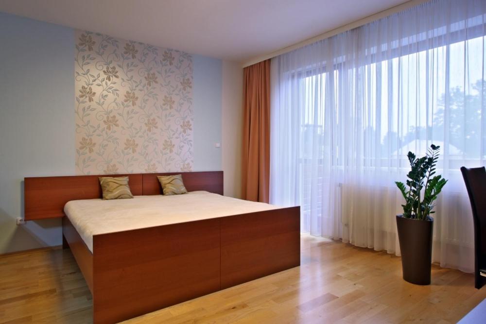 Postel nebo postele na pokoji v ubytování Apartmány Čeladná