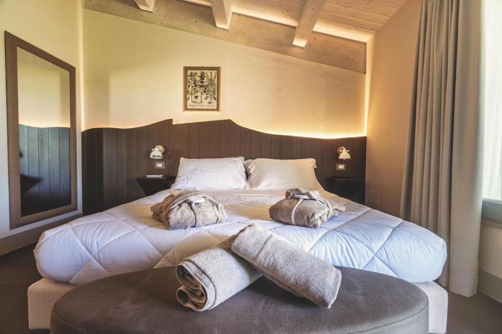 Posteľ alebo postele v izbe v ubytovaní Podere Maremma Spa & Ristorante
