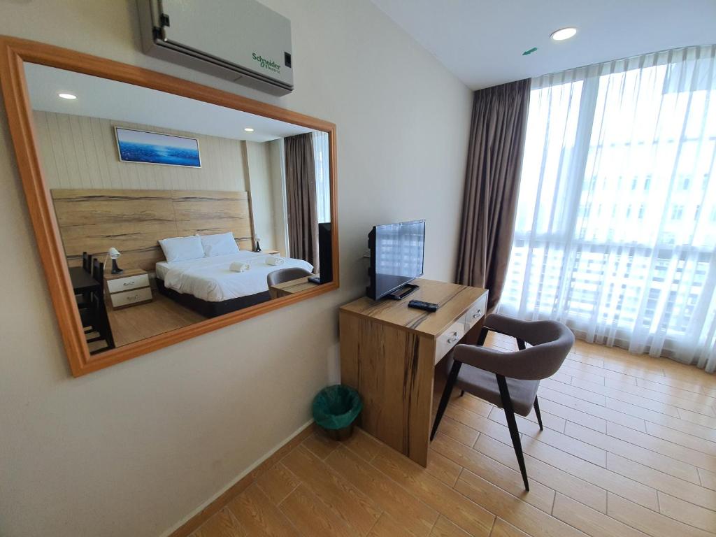 TV a/nebo společenská místnost v ubytování Bangi Perdana Hotel