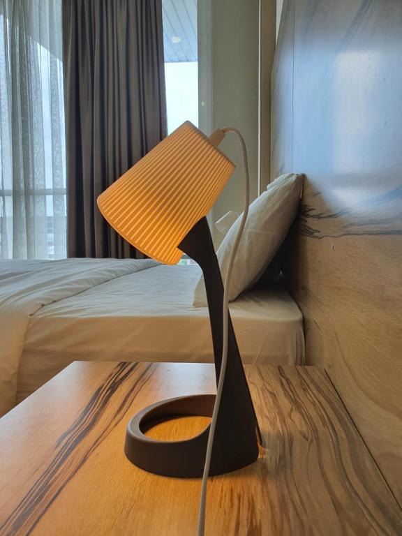 Postel nebo postele na pokoji v ubytování Bangi Perdana Hotel