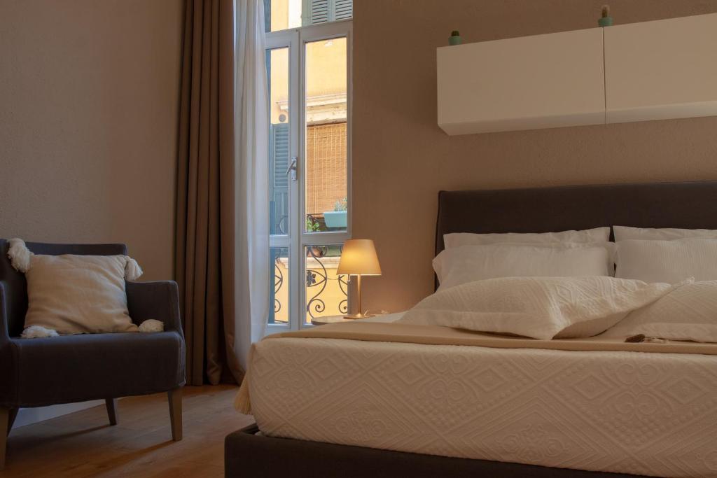 Posteľ alebo postele v izbe v ubytovaní Domus Suites Verona