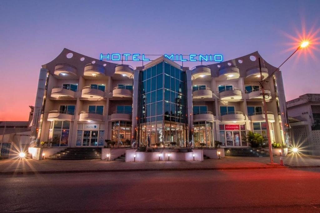 a hotel building with a sign on top of it at Hotel Milenio in Nampula