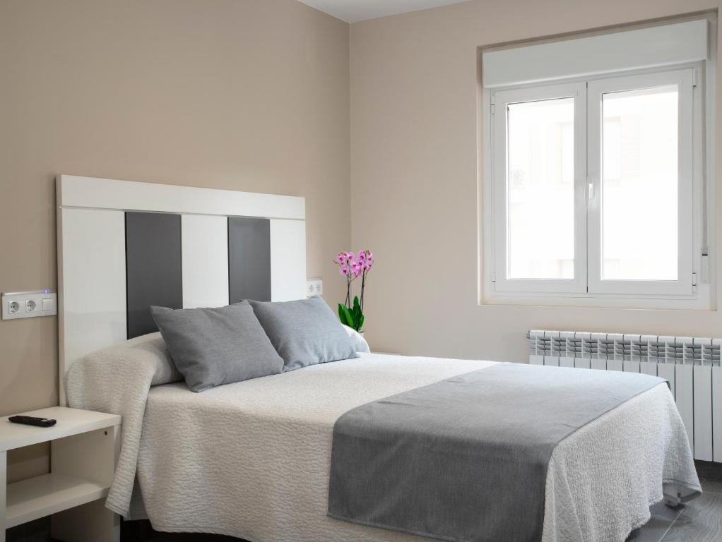 Postel nebo postele na pokoji v ubytování Hotel Querol