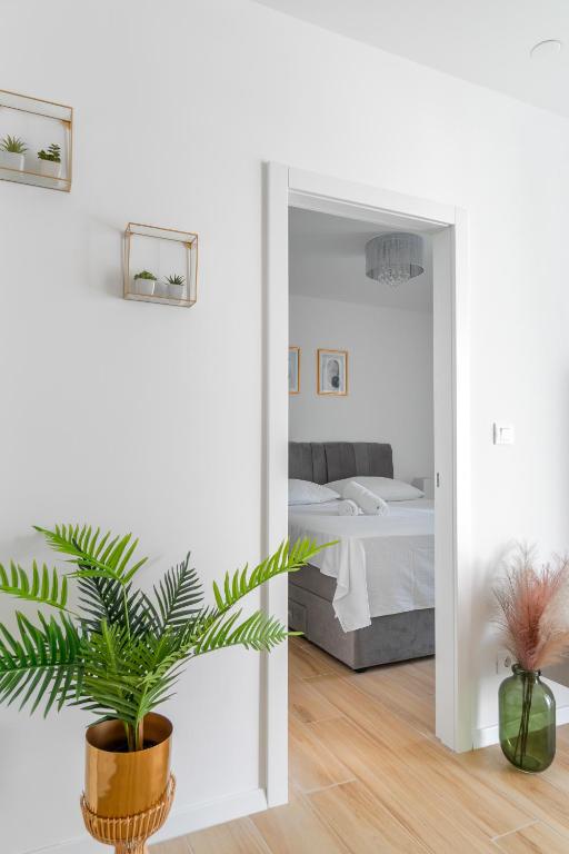 Posteľ alebo postele v izbe v ubytovaní Golden Luxury Apartment
