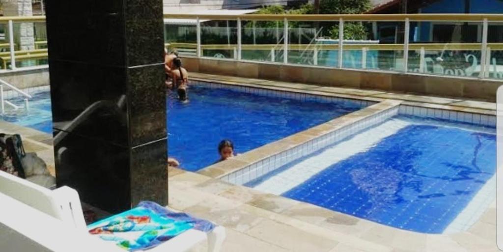  Ap família pé na praia com churrasqueira