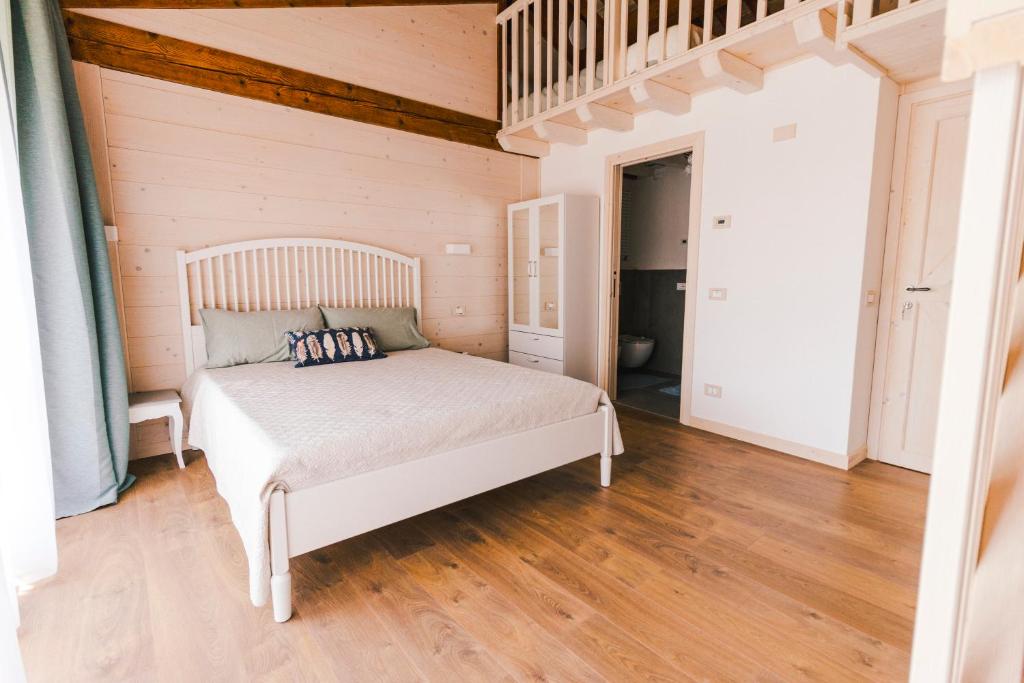Posteľ alebo postele v izbe v ubytovaní b&b al fienile
