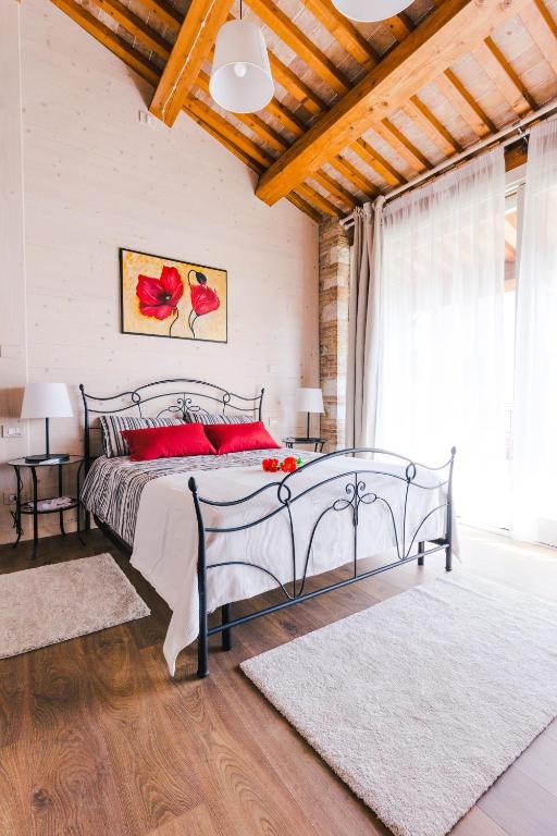Posteľ alebo postele v izbe v ubytovaní b&b al fienile