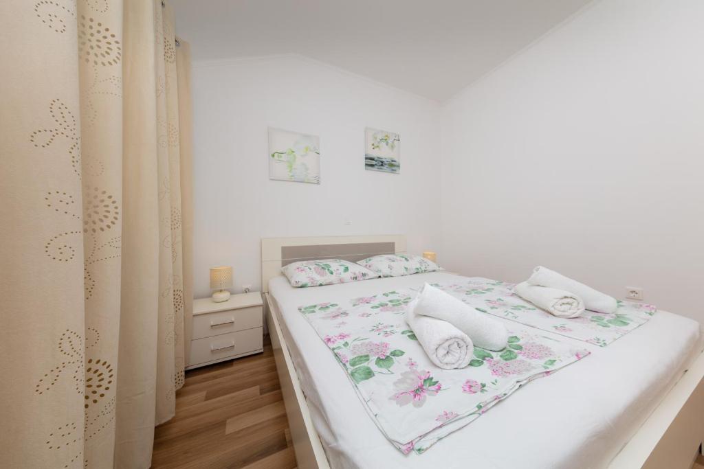 Posteľ alebo postele v izbe v ubytovaní Apartment Ela