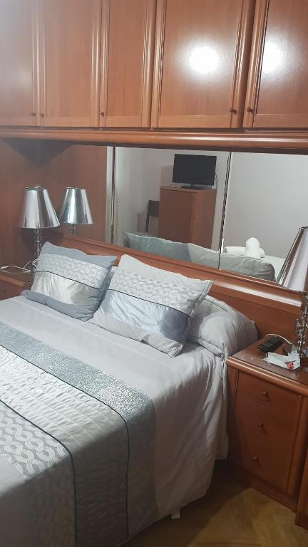 Posteľ alebo postele v izbe v ubytovaní Apartamentos Quien Anda Ahí Ribadeo