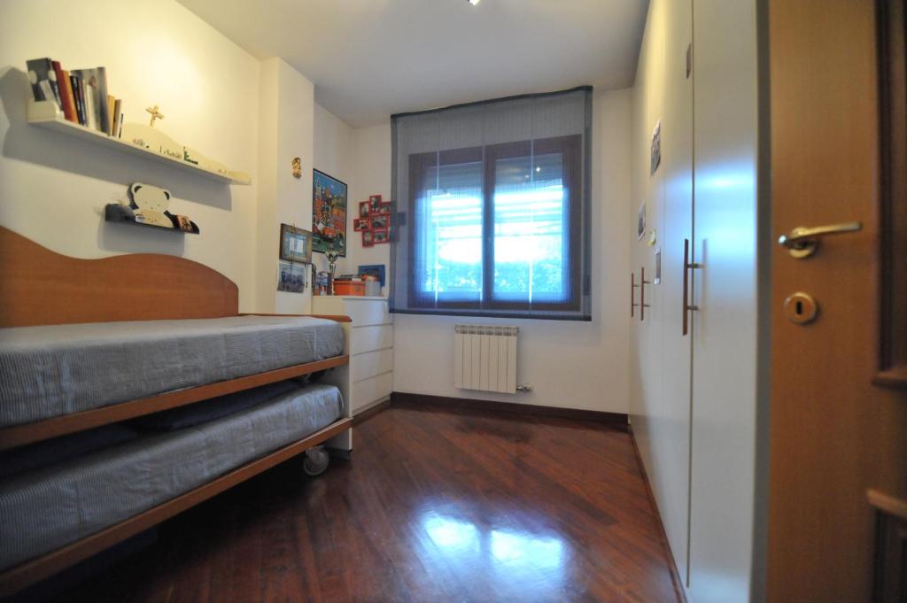A bed or beds in a room at Appartamento Cavalli