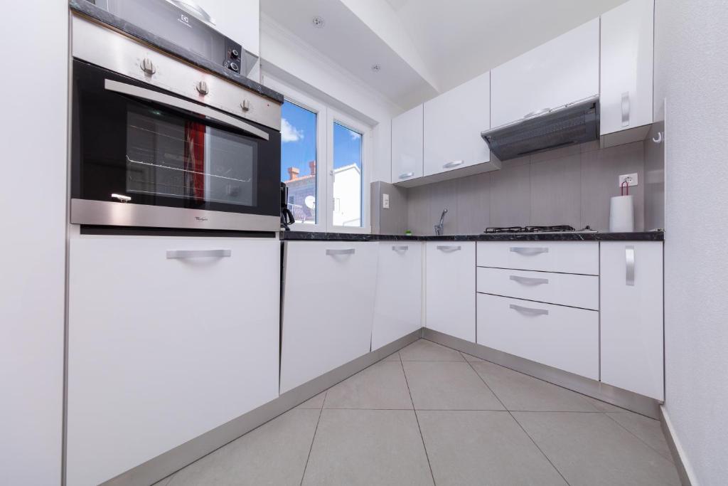 Kuchyňa alebo kuchynka v ubytovaní Apartment Ela