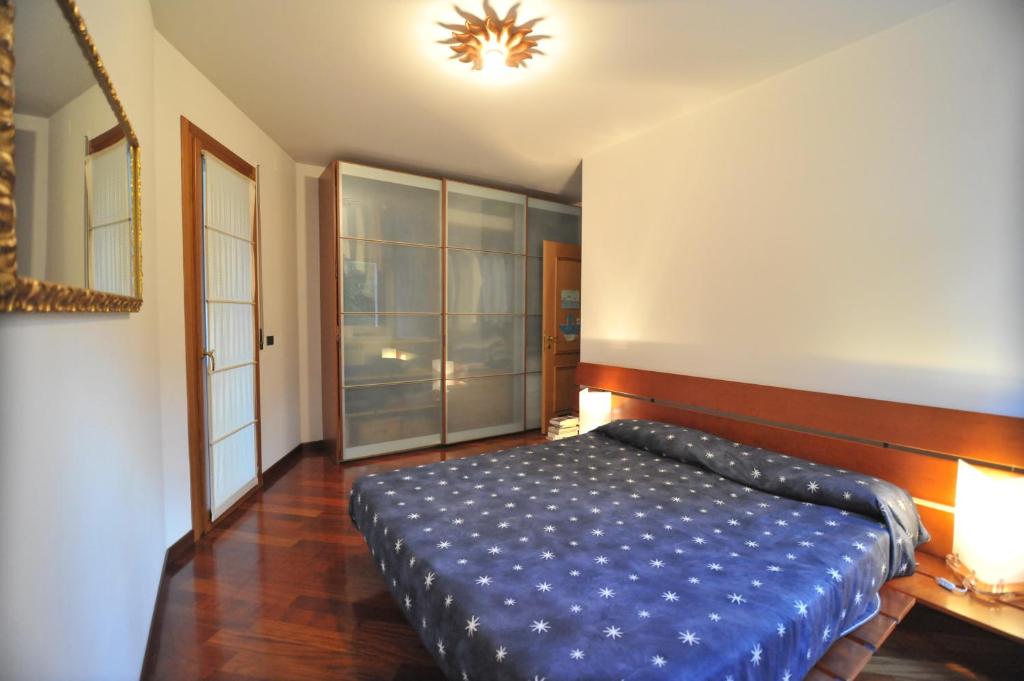 A bed or beds in a room at Appartamento Cavalli