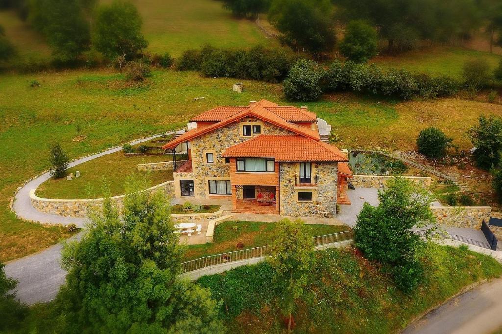 an aerial view of a house in a field at La Onda in Ramales de la Victoria