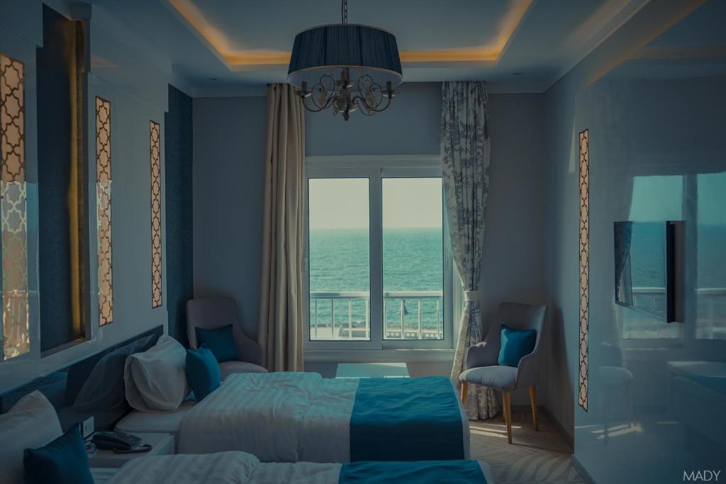Postel nebo postele na pokoji v ubytování Miramar Boutique Hotel