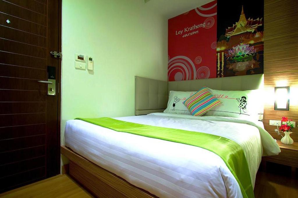 Postel nebo postele na pokoji v ubytování Ds67 Suites
