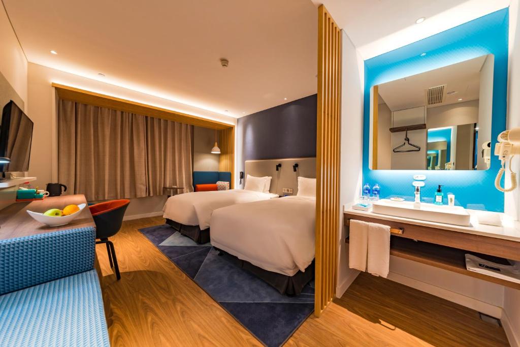 Postel nebo postele na pokoji v ubytování Holiday Inn Express Shijiazhuang High-tech Zone by IHG