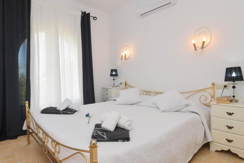 Postel nebo postele na pokoji v ubytování Amarige