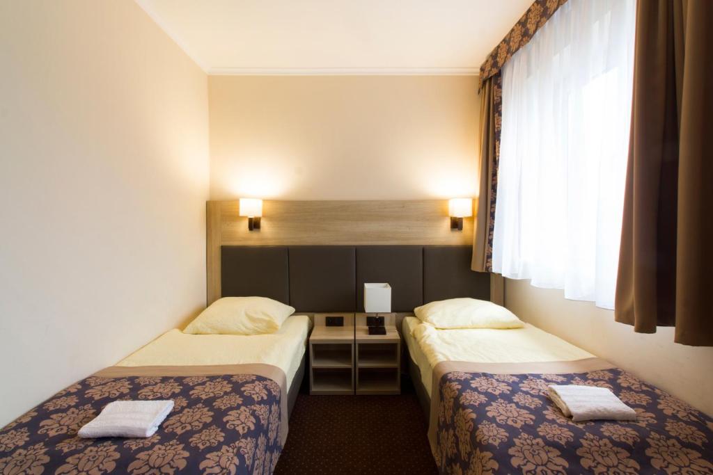 Postel nebo postele na pokoji v ubytování Motel DB2000