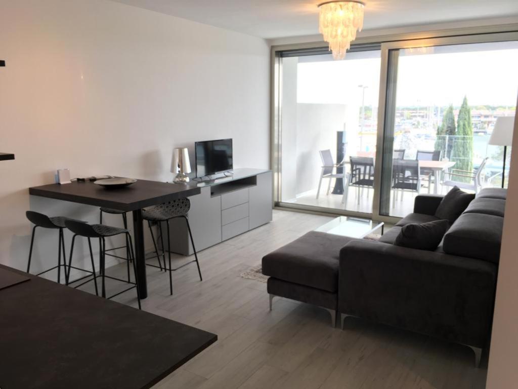 TV a/nebo společenská místnost v ubytování Laguna Palace Resort Apartment