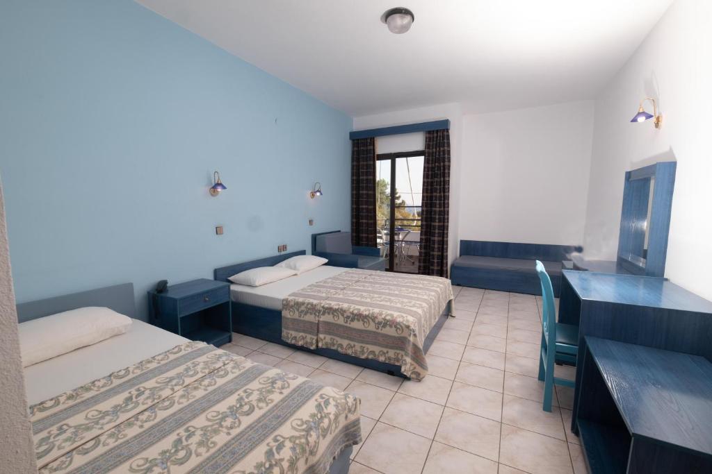Postel nebo postele na pokoji v ubytování Klio Hotel