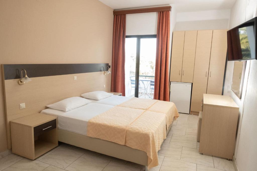 Postel nebo postele na pokoji v ubytování Klio Hotel