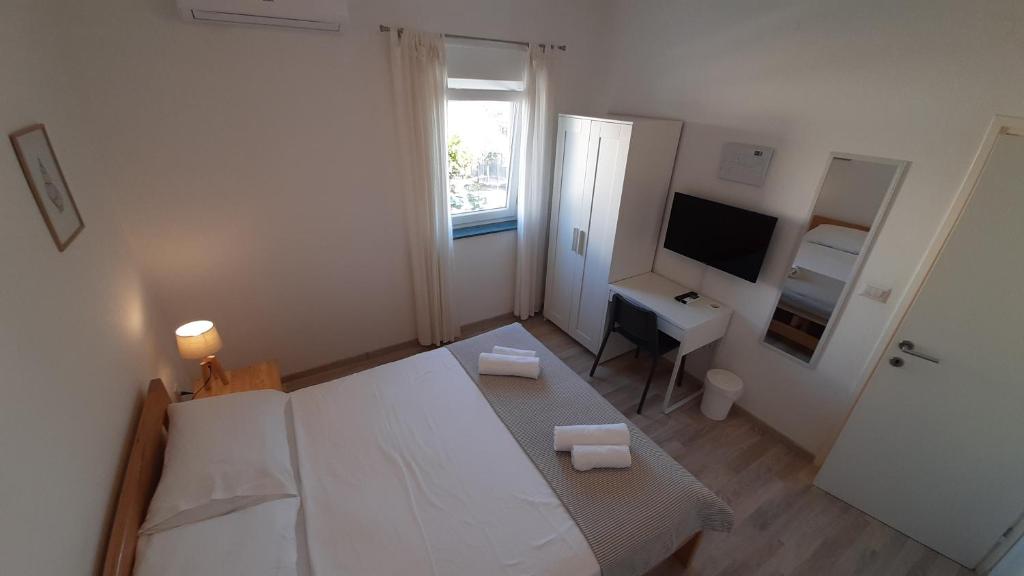 Posteľ alebo postele v izbe v ubytovaní Posteja Rooms