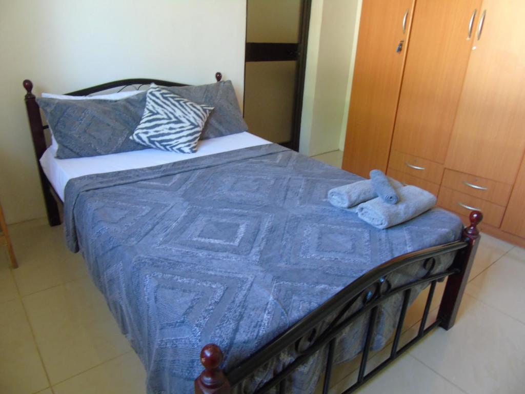 Postel nebo postele na pokoji v ubytování IDC Guest House