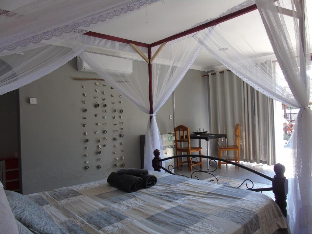 Postel nebo postele na pokoji v ubytování IDC Guest House