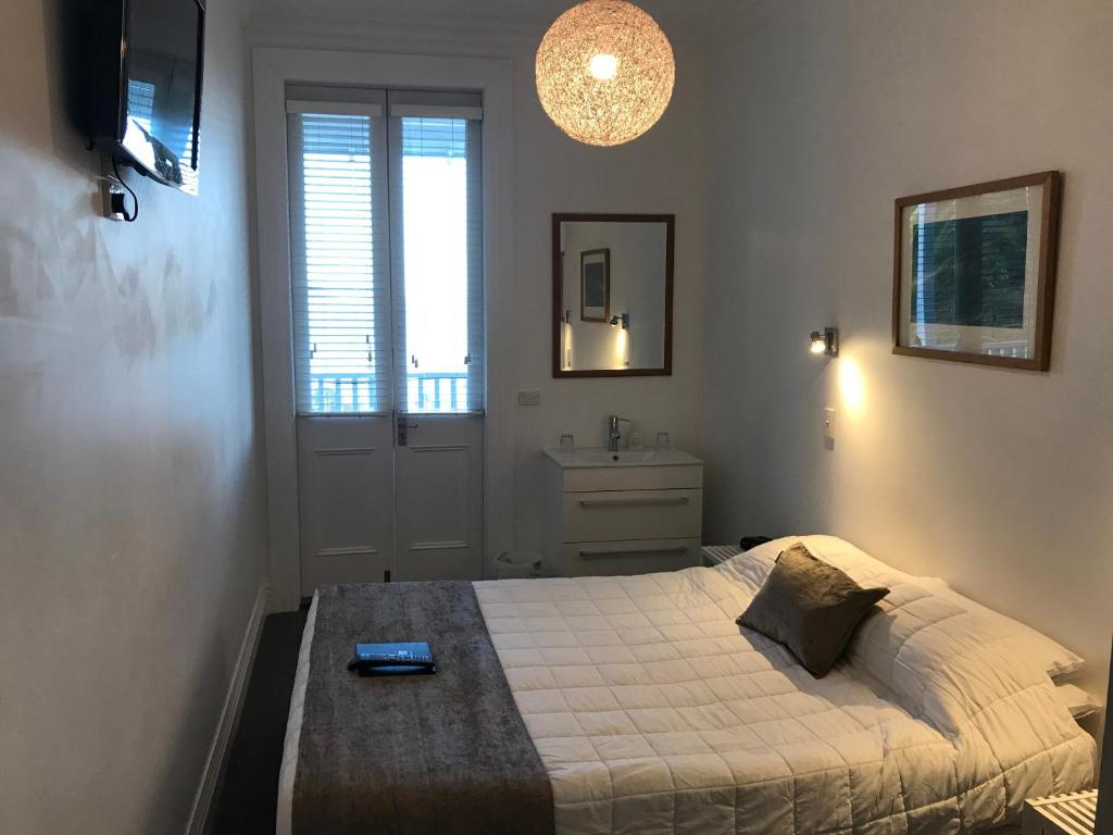 Postel nebo postele na pokoji v ubytování Ōtoromiro Hotel