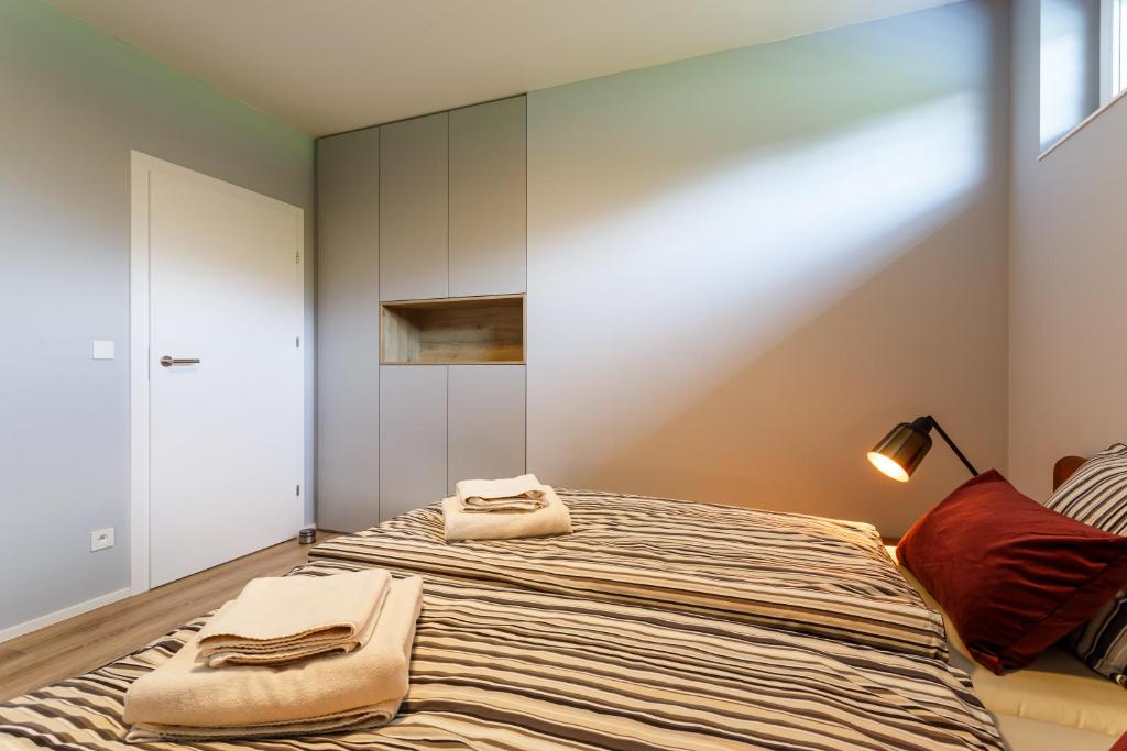 Postel nebo postele na pokoji v ubytování Apartmán na golfu