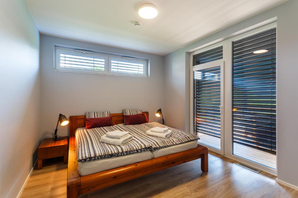 Postel nebo postele na pokoji v ubytování Apartmán na golfu